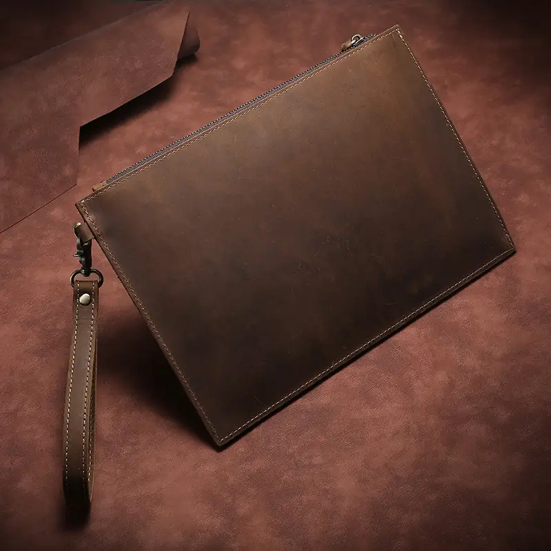 Vintage brown leather zipper clutch bag with wrist strap